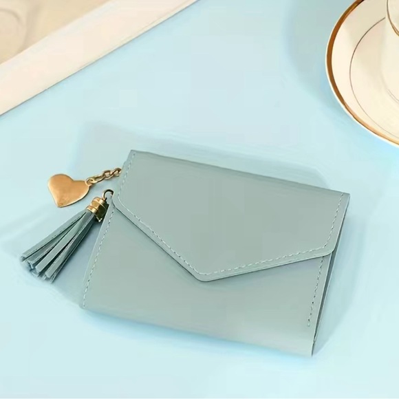 Handbags - NWT Light Blue Trifold Coin Purse with Tassel